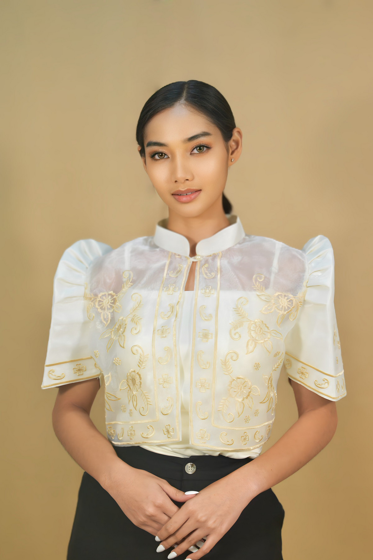 Beige organza Filipiniana bolero layered over a plain dress